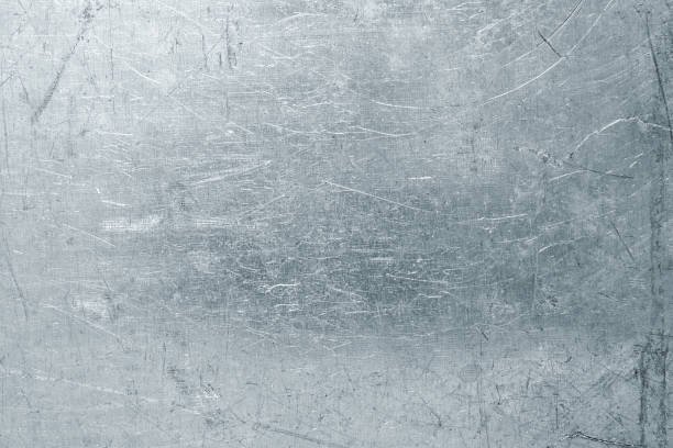 istock Worn steel sheet background, light metal texture with scratches and dents 878523162