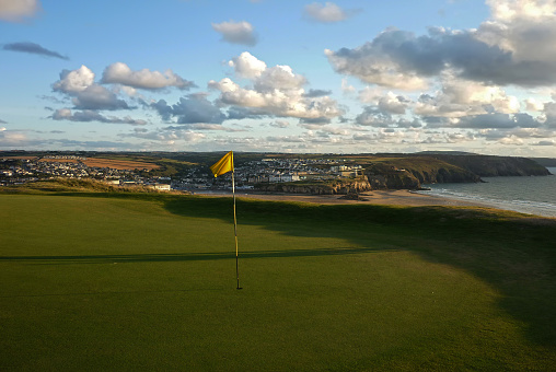 Sunset at Perranporth Golfcourse, Cornwall, United Kingdom, with view on the sea and the town