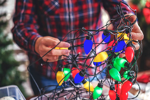 istock Decorating Christmas Tree with Ornaments and Christmas Lights 878523488