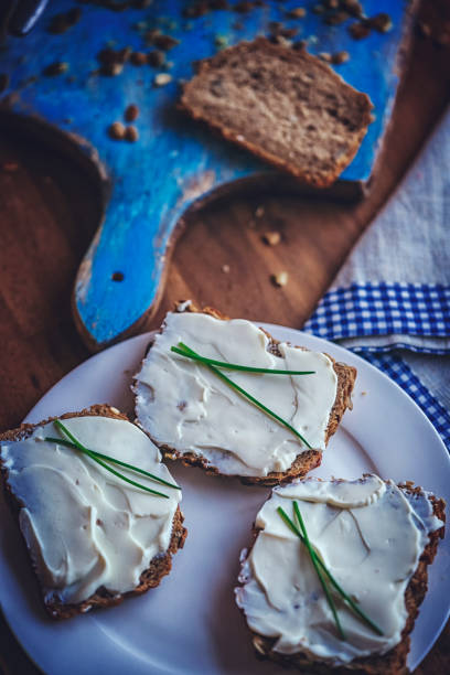 istock Fresh Homemade Brown Bread with Cream Cheese 878524300