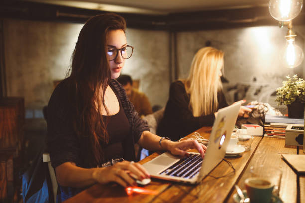 istock Two women working late in their coworking space 878534076