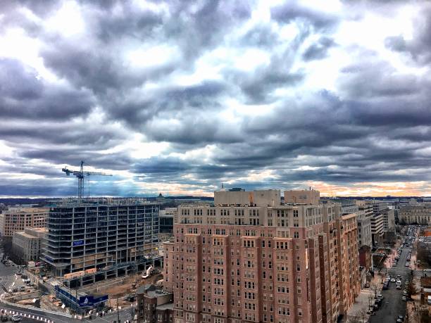 istock stormy sunset over a bustling city 878536822