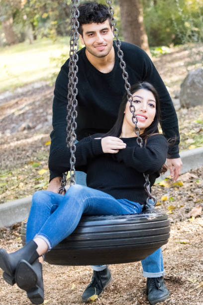 istock young couple having fun at the park 878547306