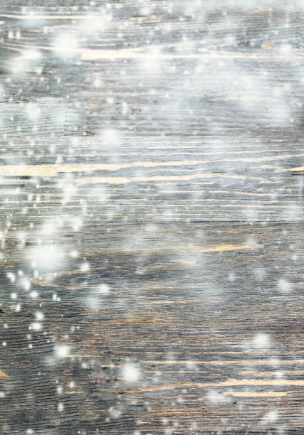 Christmas Background with falling snow. Abstract Snow Background with wooden texture