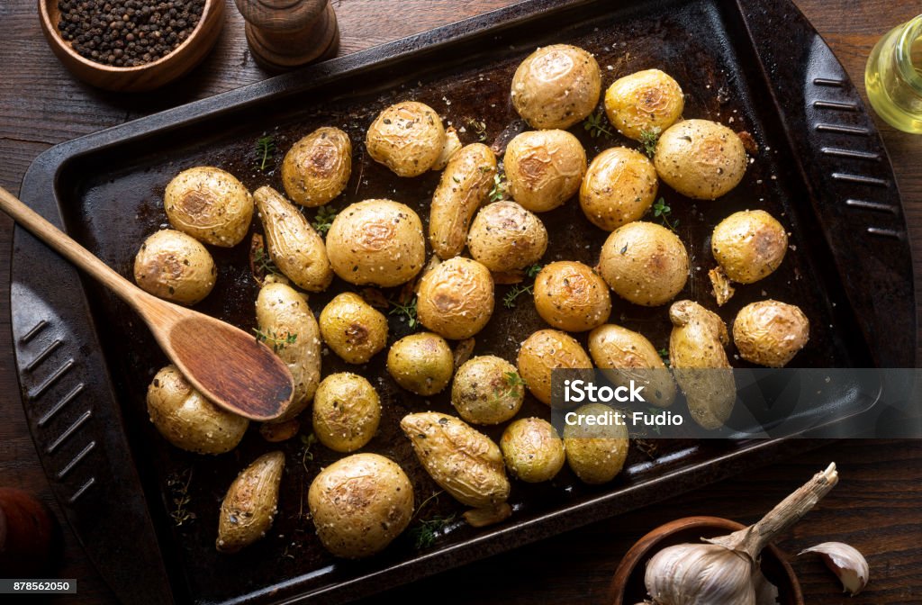 Herb and Garlic Roasted Baby Potatoes Delicious homemade herb and garlic roasted baby potatoes. Russet Potato Stock Photo