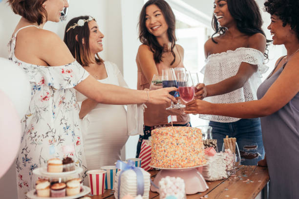 istock Multiethnic friends having a toast at baby shower 878577446