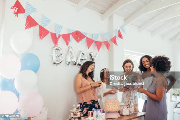 Pregnant Woman Celebrating Baby Shower With Friends Stock Photo - Download Image Now
