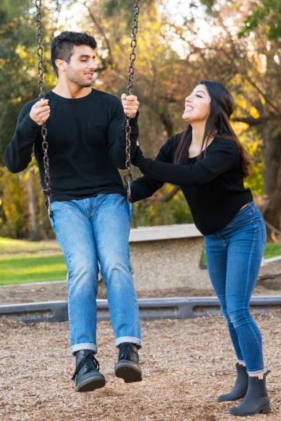 istock young couple having fun at the park 878578940