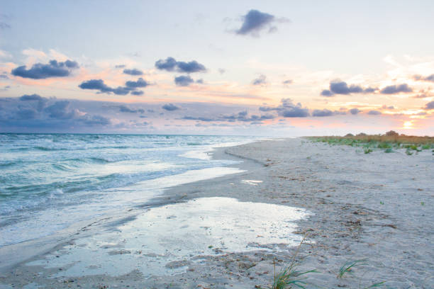 istock Empty sea coast beach landscape with sunset cloudy sky 878582118