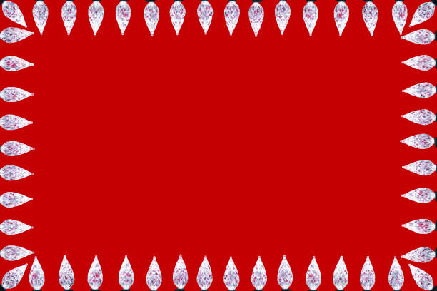 Close-up of a bunch of white / clear LED faceted Christmas Lights framing a red background