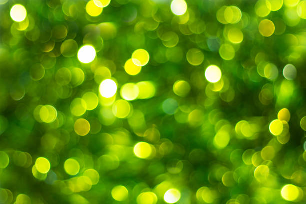 istock Defocused abstract green background. Blurred holiday bokeh 878586782