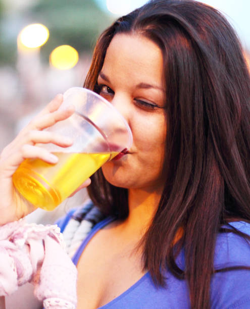 istock Girl drink beer 878592220