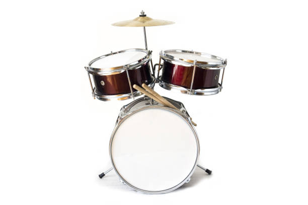 Drum kit isolated on white background Set of three drums with cymbal and drum sticks drum kit photos stock pictures, royalty-free photos & images