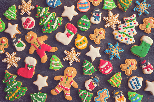 Christmas background with homemade gingerbread cookies, decoration and ingredients