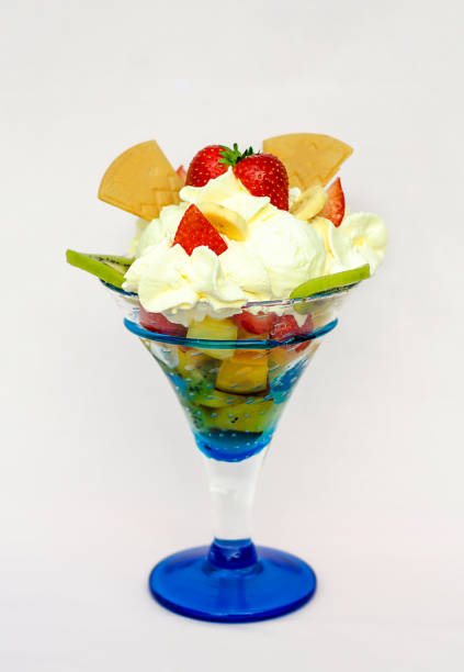 istock Ice Cream In The Cup with whip cream on White Background. Selective focus. Fruchtbecher cup 878599678