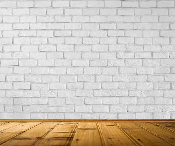 istock Empty White Brick Wall and Wood Flooring 878599946