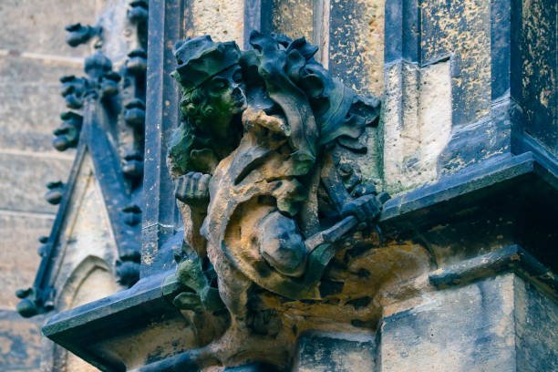 istock Czech architecture, scary gargoyle sculpture, gothic temple decoration. 878602640