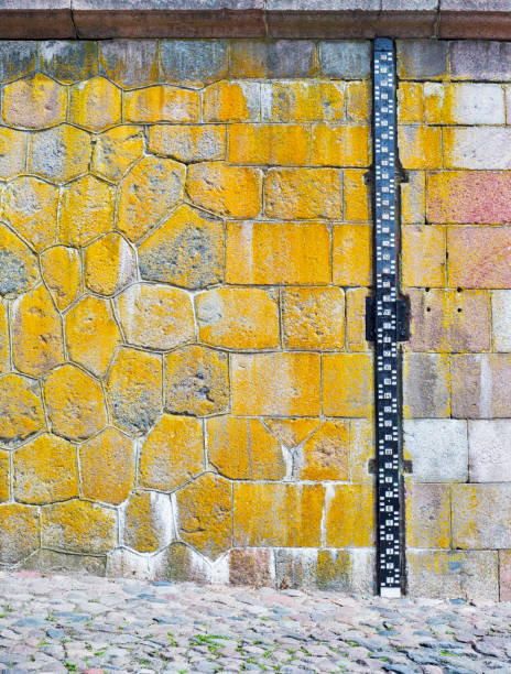 istock Water level measurement attach to the stone wall 878602770