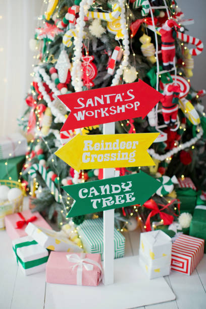 istock funny Christmas tree decorated with candies 878611578
