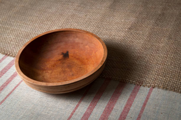 old dishes, empty wooden plate with spoon worth of linen tablecloths