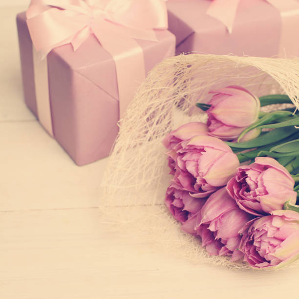 istock Floral background with flowers and gift 878620020