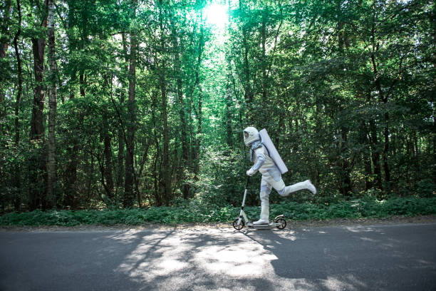 Busy cosmonaut having fun in forest