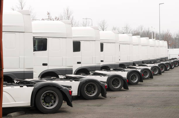 istock row of white trucks 878622714