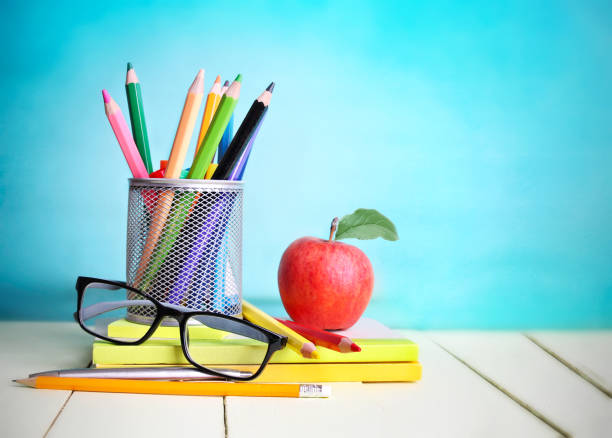 istock Back to school concept.Education supplies empty blue background. 878623422