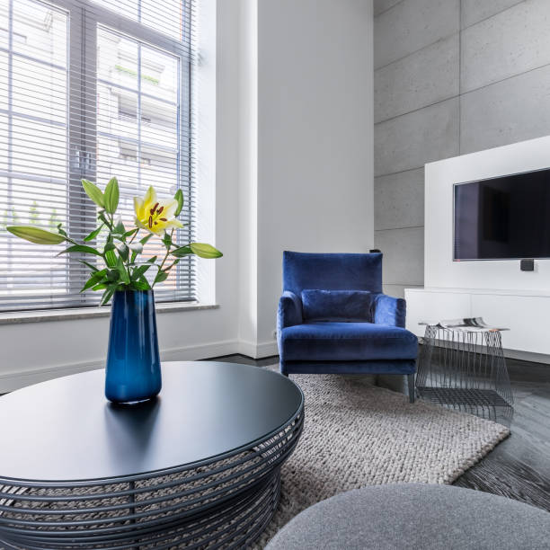 istock Tv, upholstered armchair and coffee table 878626752