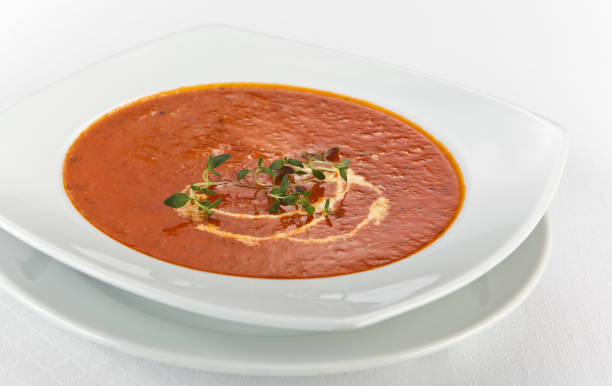 fresh tomato soup with cream in a plate