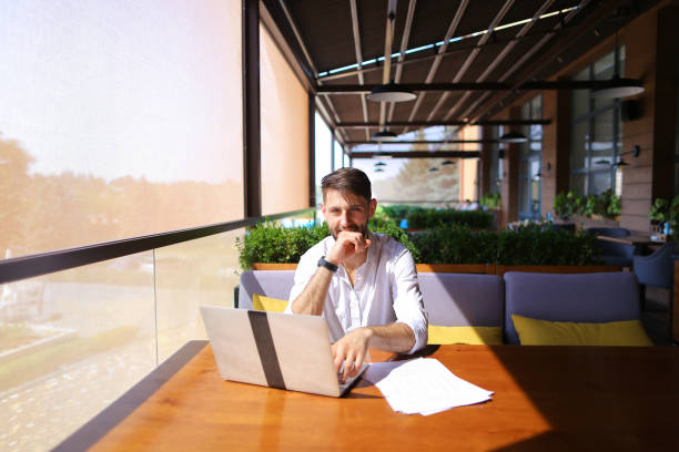 istock Caucasian Real Estate Agent working with laptop and chatting with client o 878629562