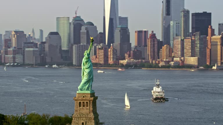 AERIAL Statue of Liberty and Lower Manhattan in sunshine