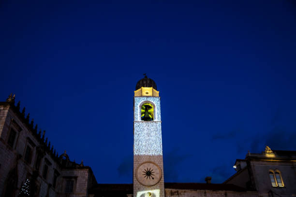 Clocktower with illuminated christmas decoration at night in Dubrovnik, Croatia, Europe