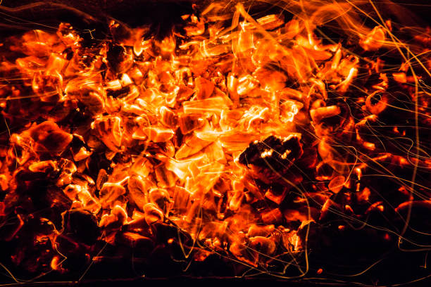 istock abstract background. burning charcoals with sparks 878639074