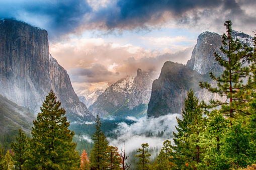 The iconic view from Tunnel View of the majesty of Yosemite National Park on a stormy early sping evening.