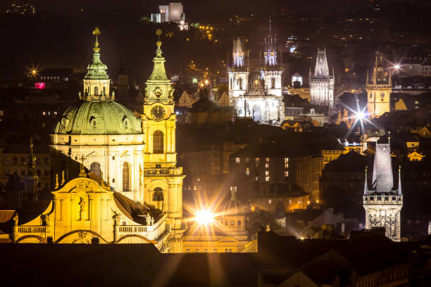 Night scenery of Prague, Czech Republic Night panorama of the old town with Charles Bridge and Cathedral in Prague st nicholas church prague stock pictures, royalty-free photos & images