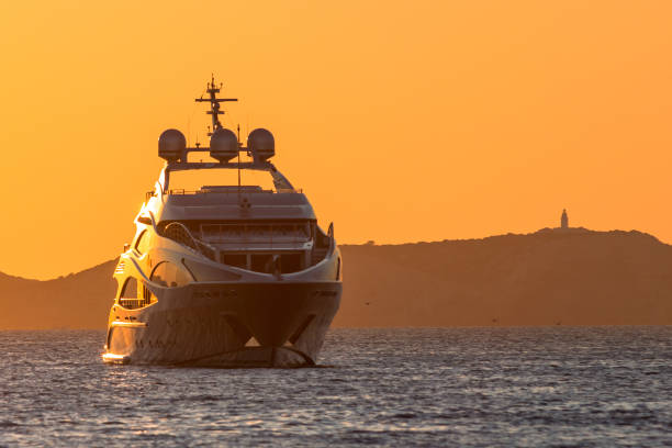 Luxury yacht at sunset stock photo