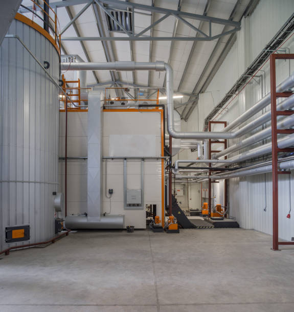 istock Modern boiler room on the wooden chips. 878659306