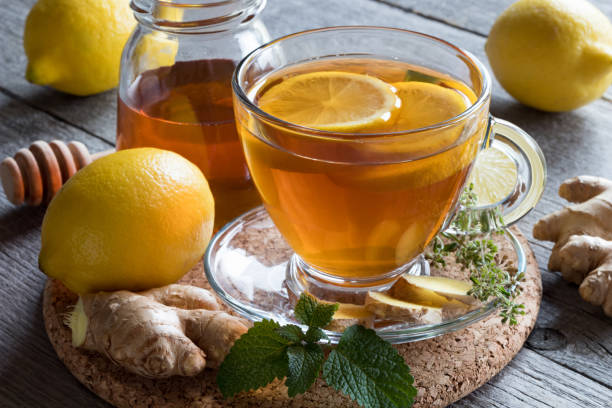 istock A cup of tea with ginger, lemon, melissa and honey 878659662