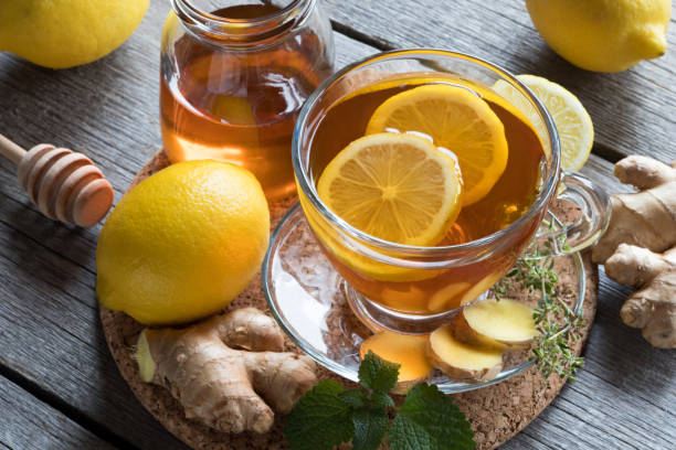 istock A cup of tea with ginger, lemon, melissa and honey 878659666