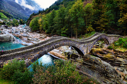 hiking Trail at the famous Roman Bridge called Ponte dei Salti in Lavertezzo,Verzasca Valley,Ticino Canton,Switzerland