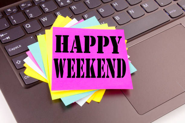 istock Writing Happy Weekend text made in the office close-up on laptop computer keyboard. Business concept for Holiday Day Off Celebration Workshop on the black background with copy space 878674000