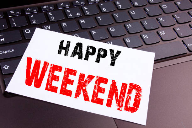istock Writing Happy Weekend text made in the office close-up on laptop computer keyboard. Business concept for Holiday Day Off Celebration Workshop on the black background with copy space 878674064