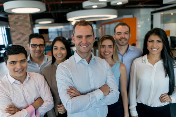 istock Successful business team looking happy at the office 878674804