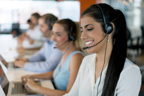 istock Happy group of people working at a call center 878674818