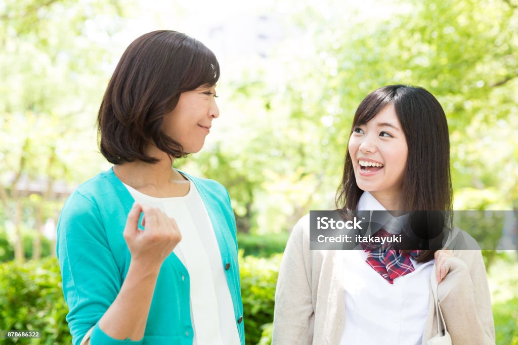 asian family walking in park High School Student Stock Photo