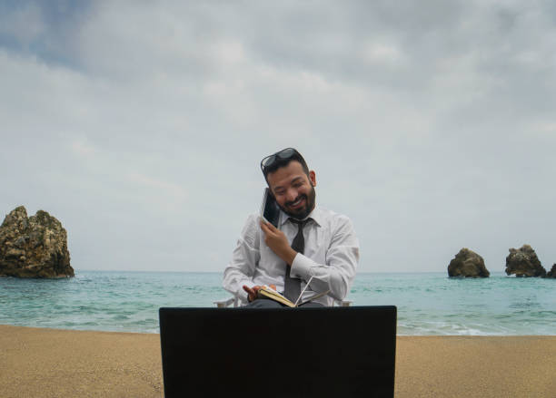 istock Businessman on the Beach - Work Follow 878686760