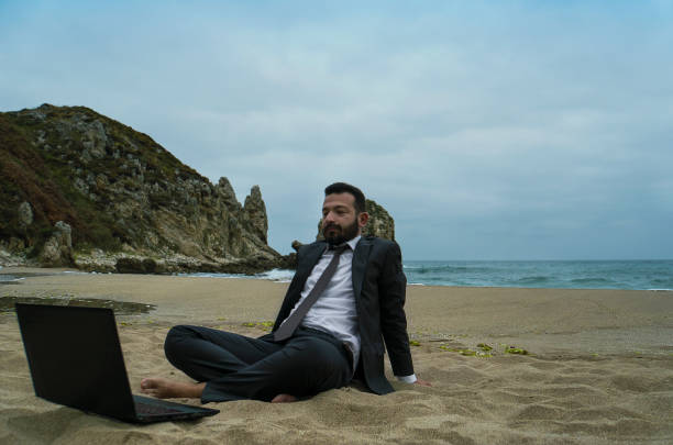 istock Businessman on the Beach - Work Follow 878686850