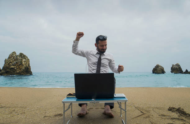 istock Businessman on the Beach - Work Follow 878686868