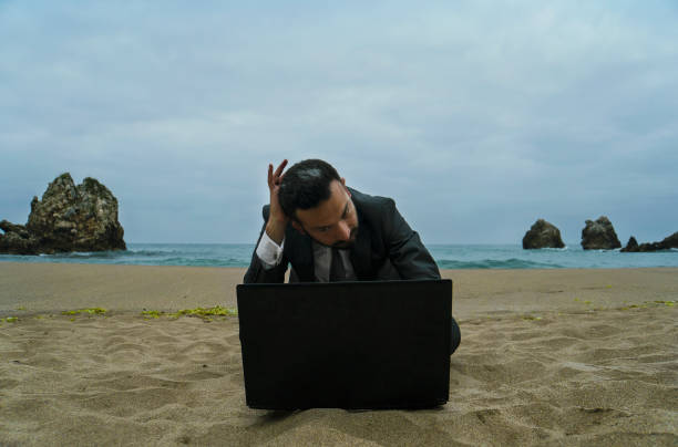 istock Businessman on the Beach - Work Follow 878686874